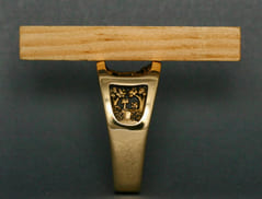 A straight edge across the top of the Whitetail Deer Ring shows how far the sculpture is recessed below the surface for protection from wear.